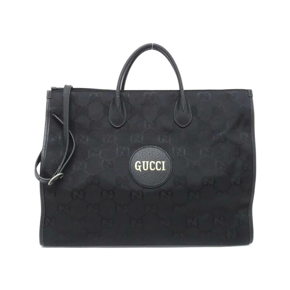 Gucci The Grid tote bag prominent circular leather logo patch